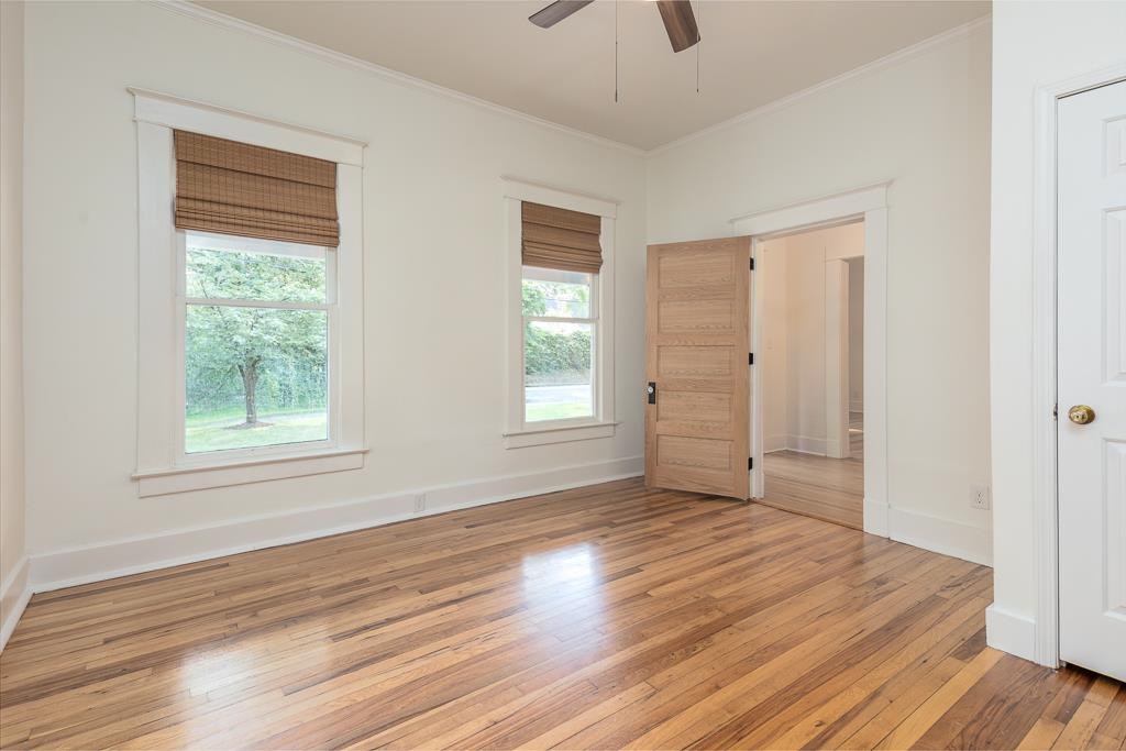 119 South Fenwick Road Memphis, TN 38111 - Photo 25 of 28 a view of an empty room with wooden floor and a window