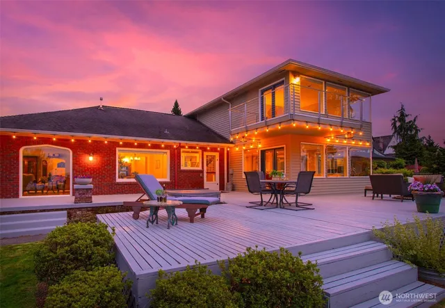 a view of a patio with a table and chairs under an umbrella