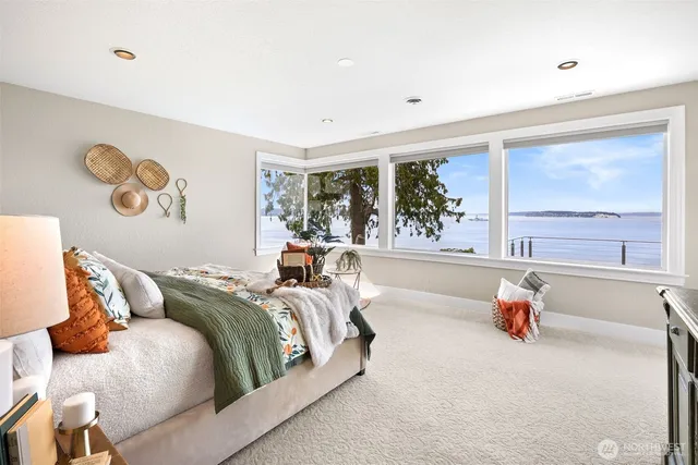a bedroom with a bed and chandelier