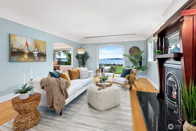 an outdoor sitting area with furniture and garden view