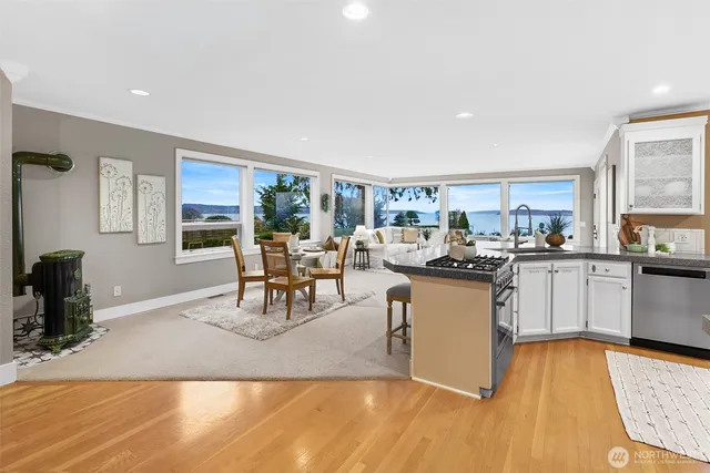 a view of a patio with a table and chairs and potted plants