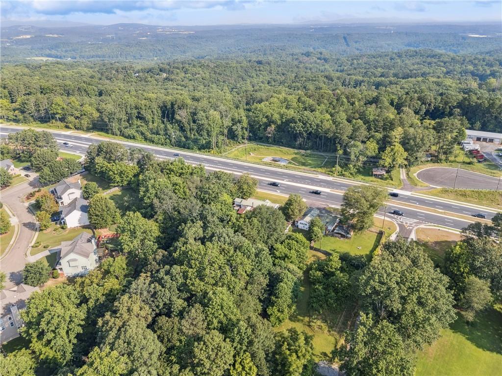 4072 Cumming Highway Canton, GA 30115 - Photo 3 of 10 a view of a city with lush green forest