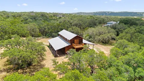 a view of a back yard from a balcony
