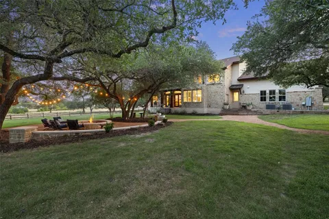 a view of a park with bench and trees