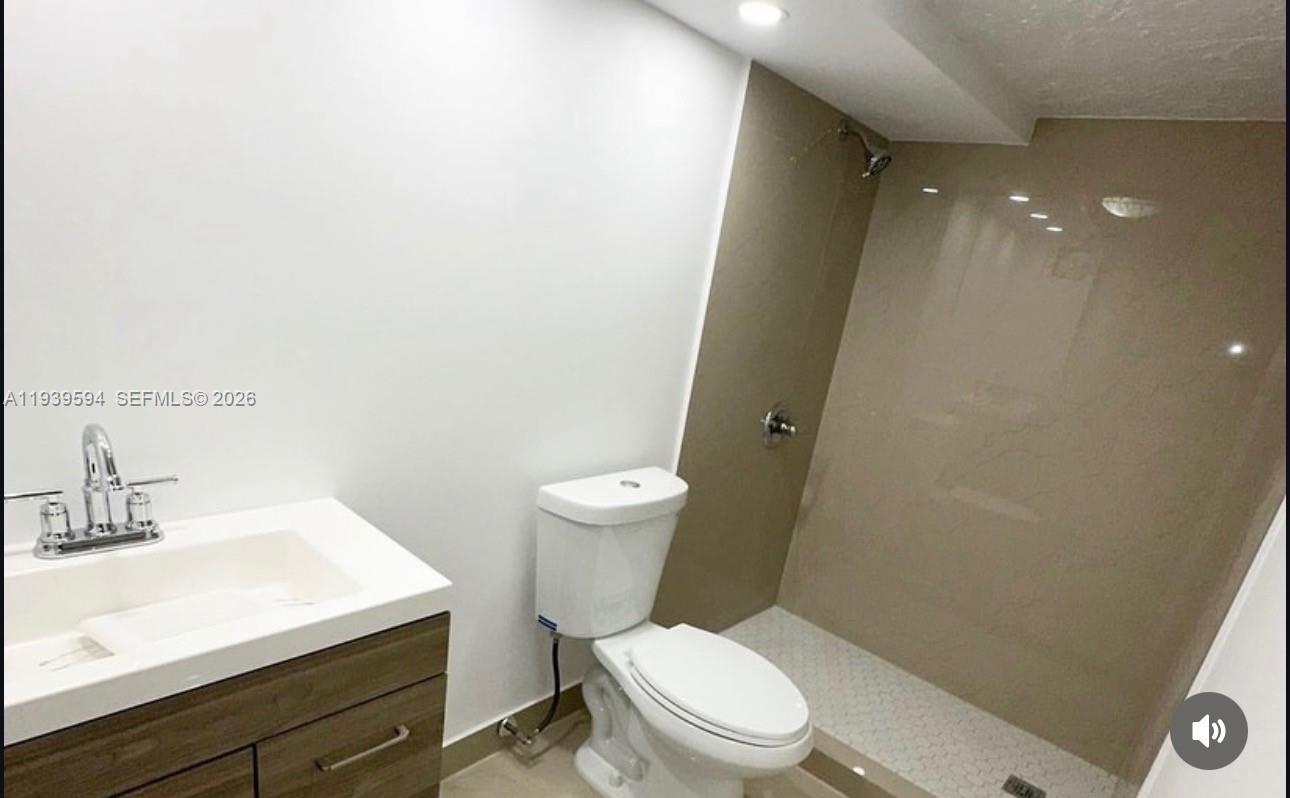 6537 Southwest 39th Terrace Miami, FL 33155 - Photo 11 of 22 a white toilet sitting next to a bathroom sink