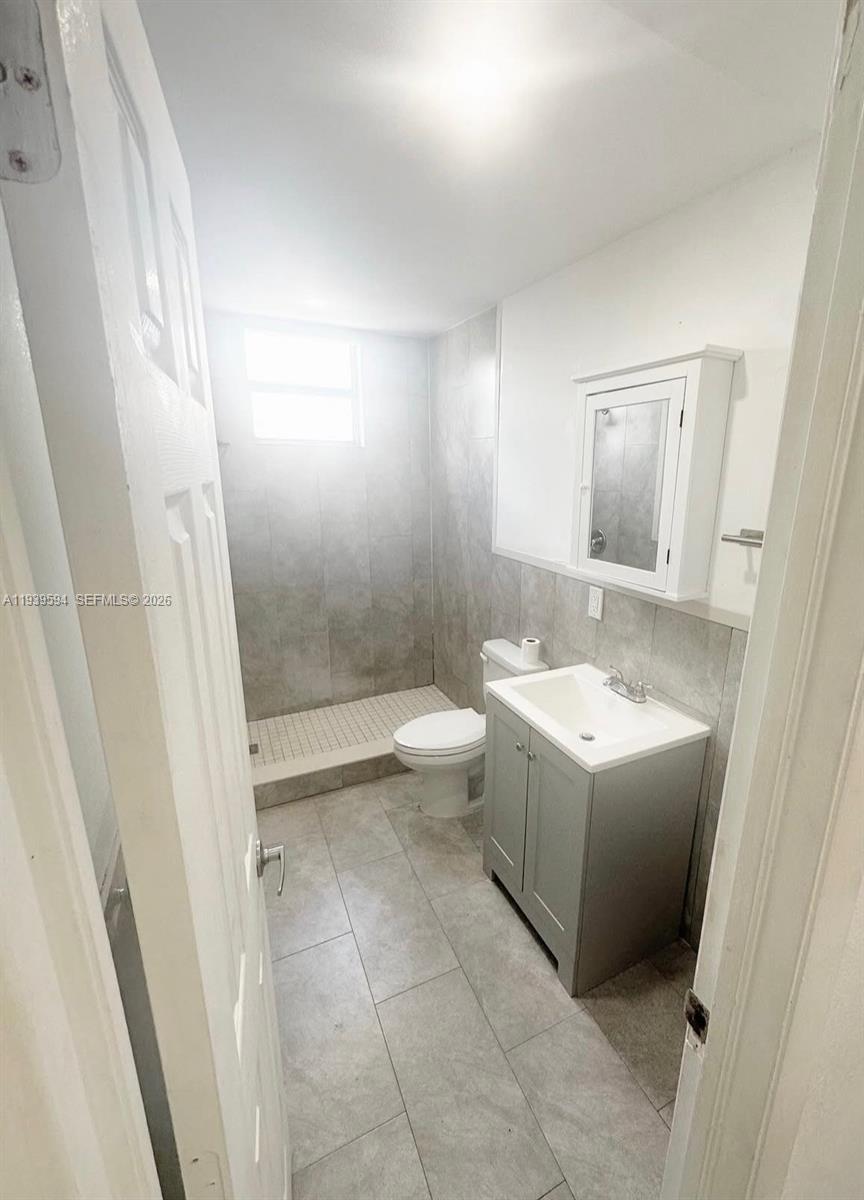 6537 Southwest 39th Terrace Miami, FL 33155 - Photo 14 of 22 a bathroom with a sink a toilet and shower