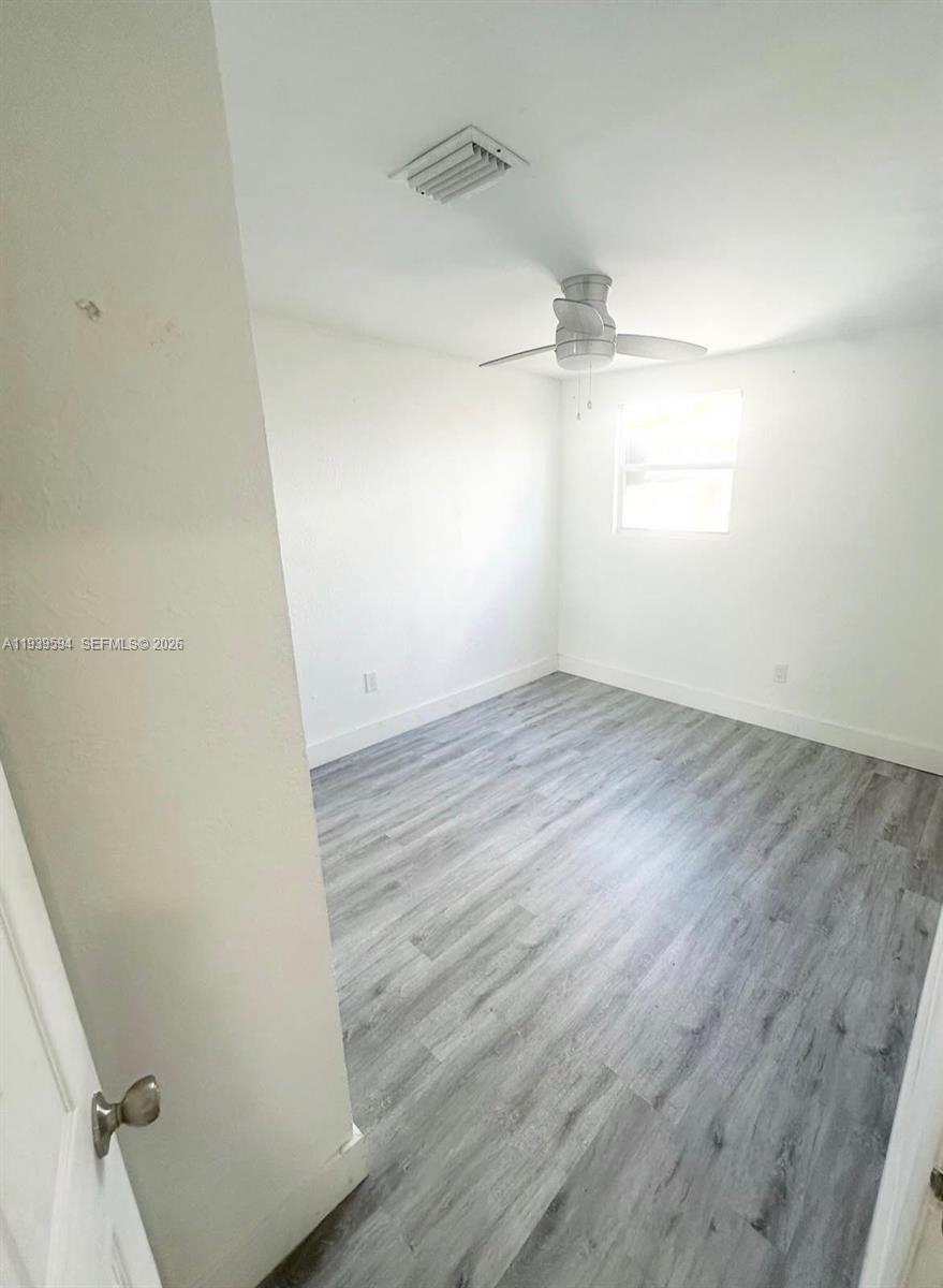 6537 Southwest 39th Terrace Miami, FL 33155 - Photo 15 of 22 wooden floor in an empty room