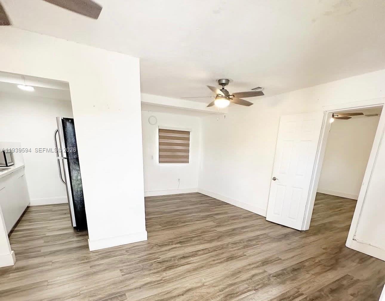 6537 Southwest 39th Terrace Miami, FL 33155 - Photo 17 of 22 an empty room with wooden floor and entrance