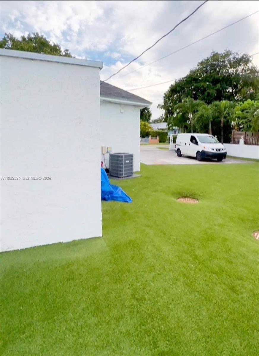 6537 Southwest 39th Terrace Miami, FL 33155 - Photo 4 of 22 a front view of a house with garden