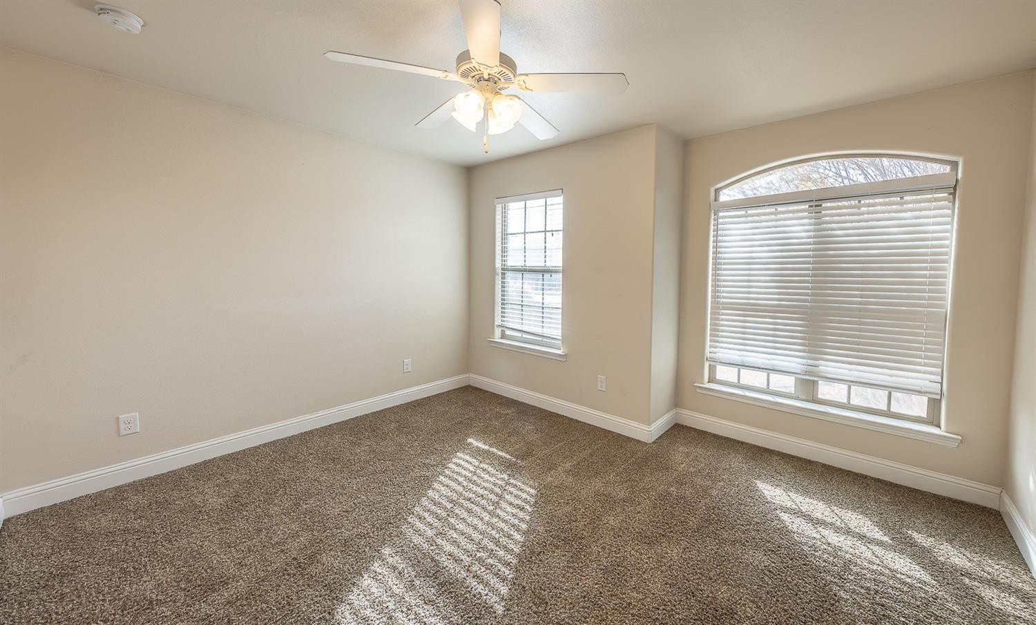 5504 110th Street Lubbock, TX 79424 - Photo 15 of 23 a view of an empty room with a window