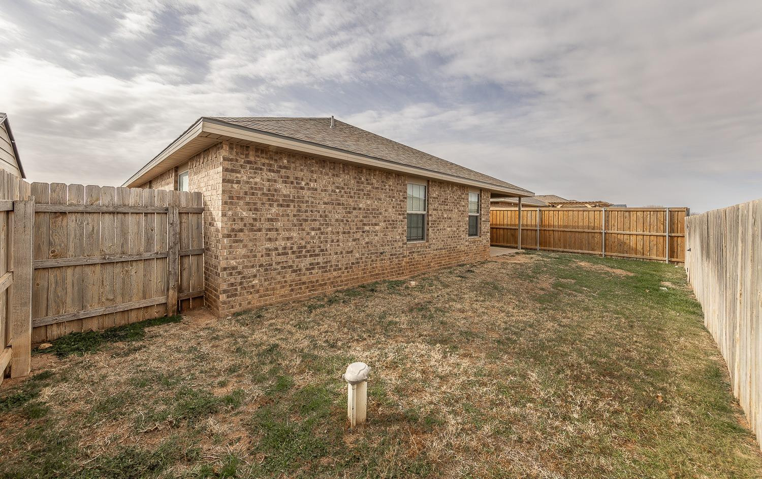 5504 110th Street Lubbock, TX 79424 - Photo 21 of 23 a backyard of a house