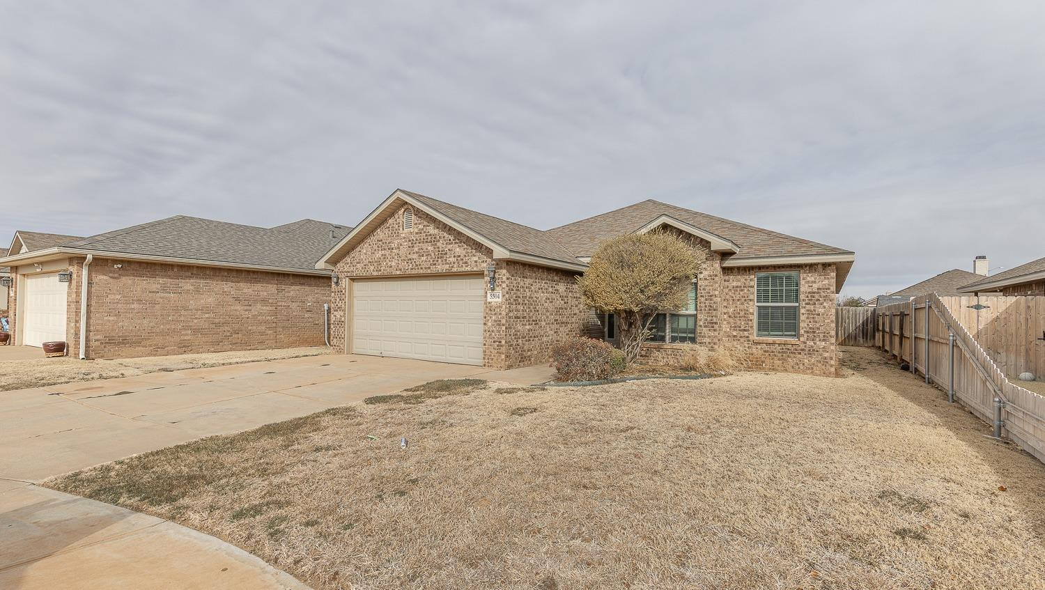 5504 110th Street Lubbock, TX 79424 - Photo 23 of 23 front view of a house with a yard