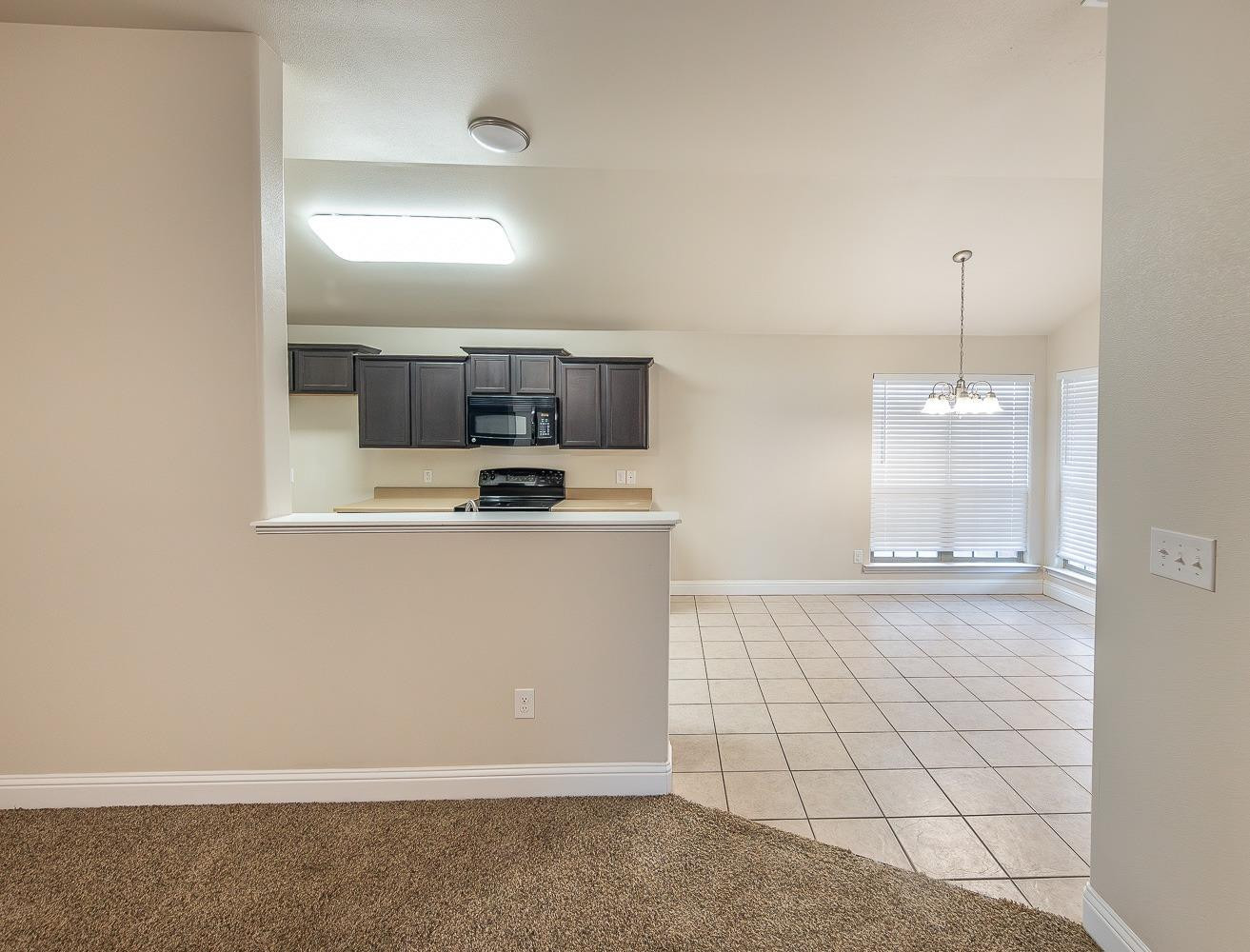 5504 110th Street Lubbock, TX 79424 - Photo 7 of 23 a view of a kitchen with a sink