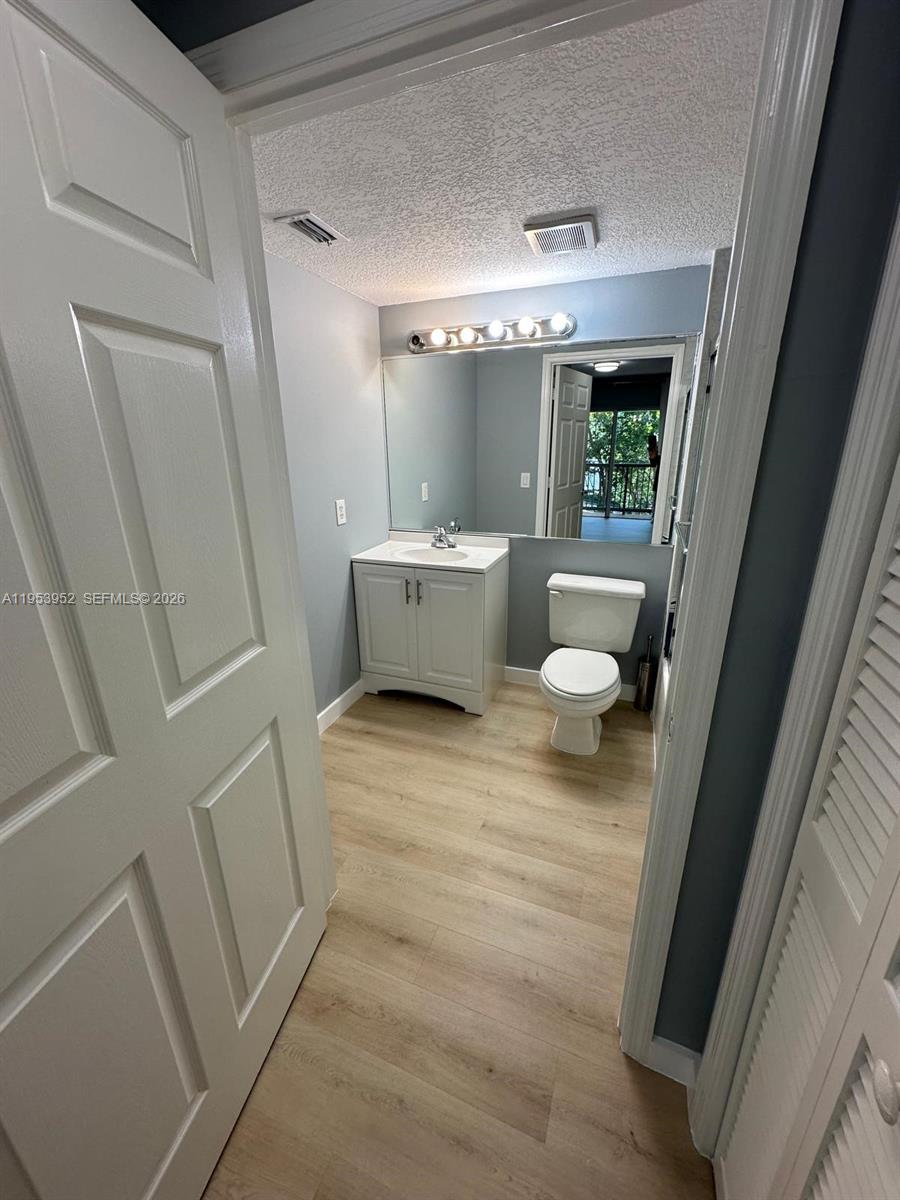 1918 Brickell Avenue, Unit 305 Miami, FL 33129 - Photo 11 of 17 a bathroom with a sink and toilet
