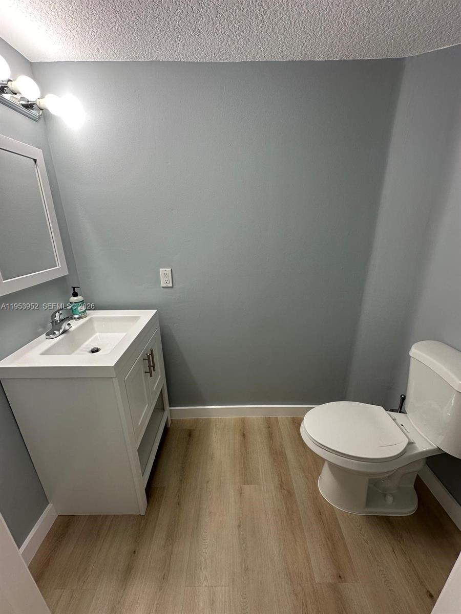 1918 Brickell Avenue, Unit 305 Miami, FL 33129 - Photo 13 of 17 a bathroom with a sink and a toilet