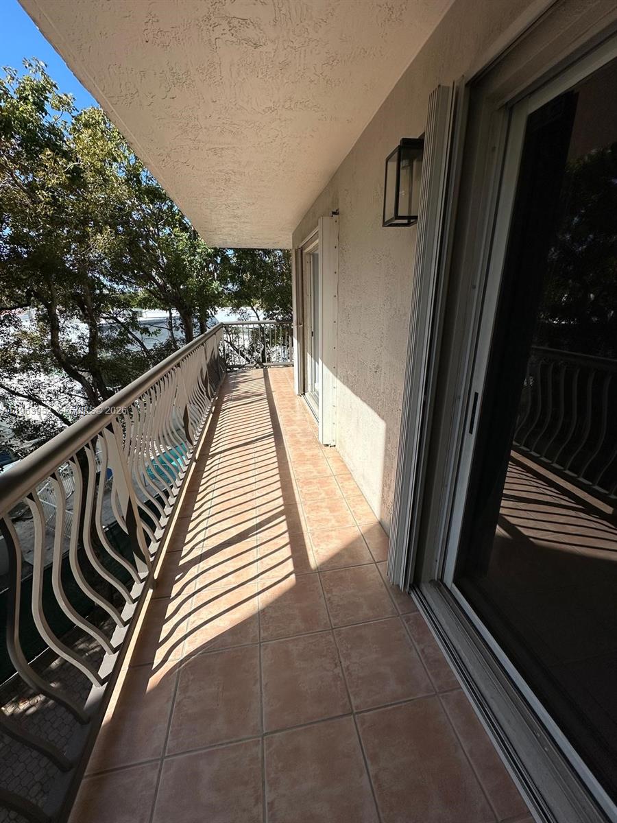1918 Brickell Avenue, Unit 305 Miami, FL 33129 - Photo 14 of 17 a view of balcony and car