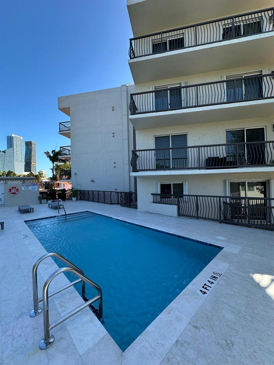 1918 Brickell Avenue, Unit 305 Miami, FL 33129 - Photo 16 of 17 a workspace with furniture