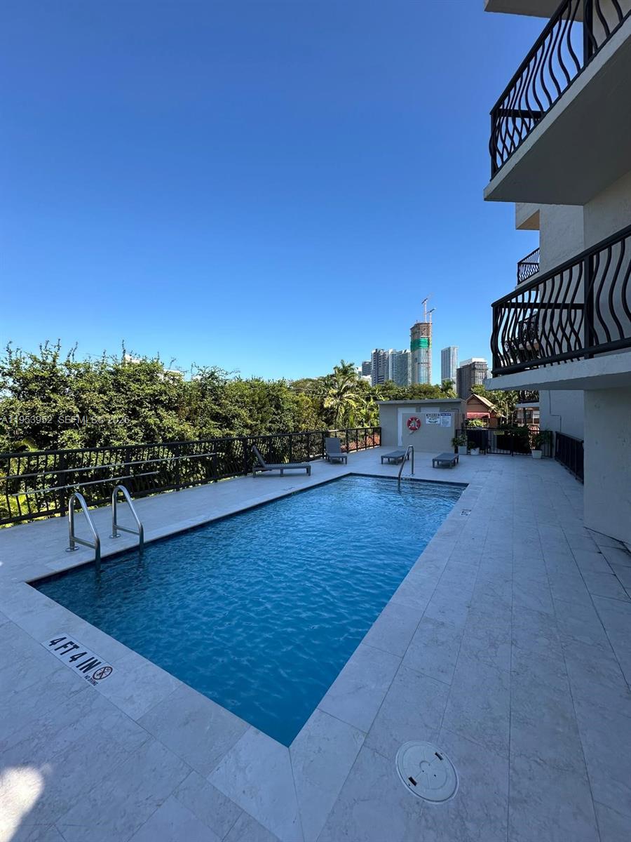 1918 Brickell Avenue, Unit 305 Miami, FL 33129 - Photo 17 of 17 a view of a terrace with chairs