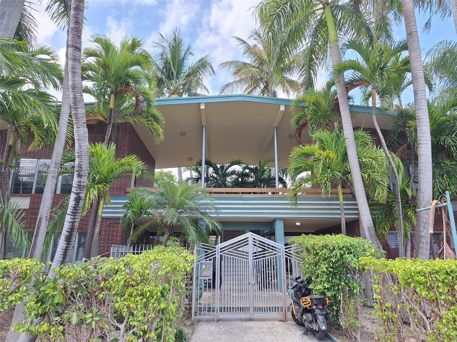 1770 Meridian Avenue, Unit 207 Miami Beach, FL 33139 - Photo 20 of 26 a front view of a house with a yard garden and swimming pool