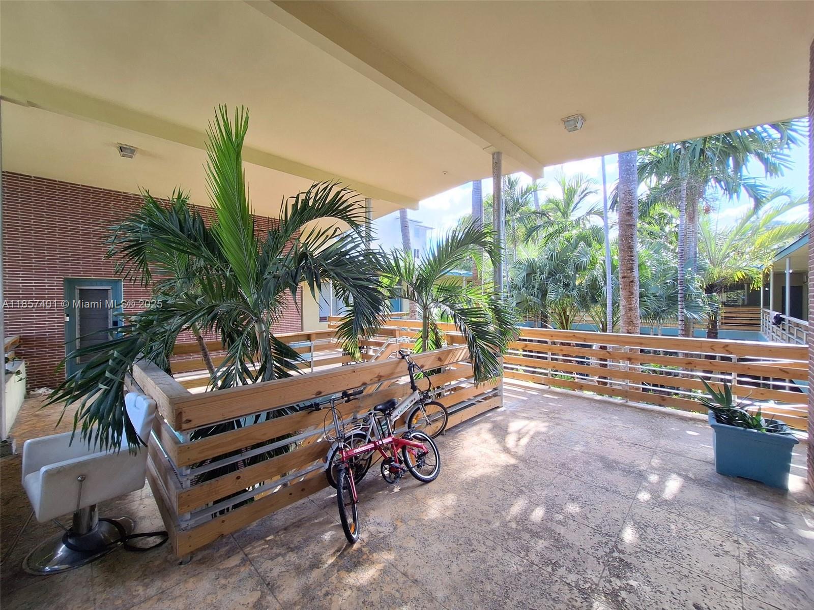 1770 Meridian Avenue, Unit 207 Miami Beach, FL 33139 - Photo 2 of 26 a building outdoor space with patio lots of furniture