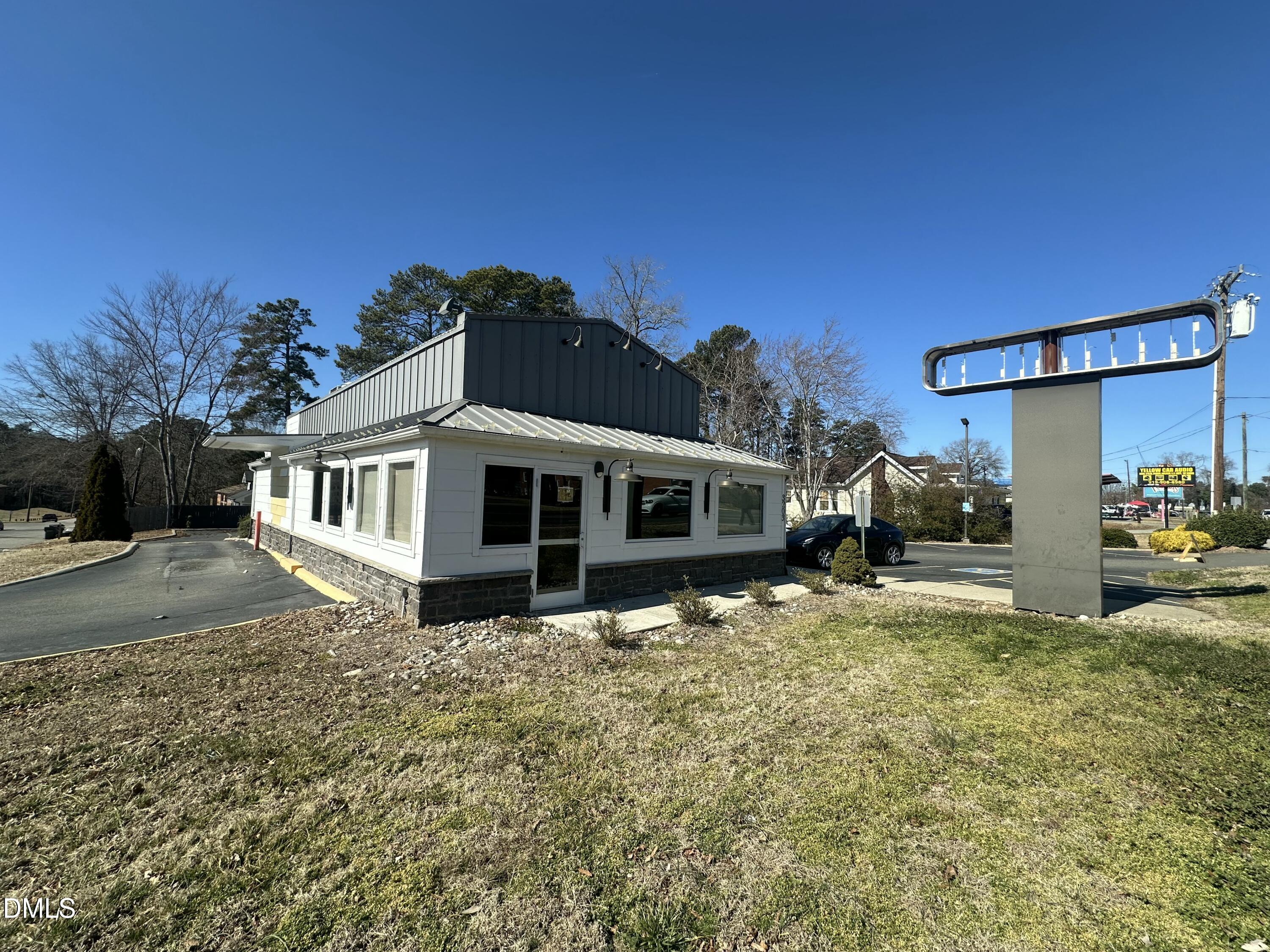 3203 North Roxboro Street Durham, NC 27704 - Photo 4 of 14 a front view of a house with a yard