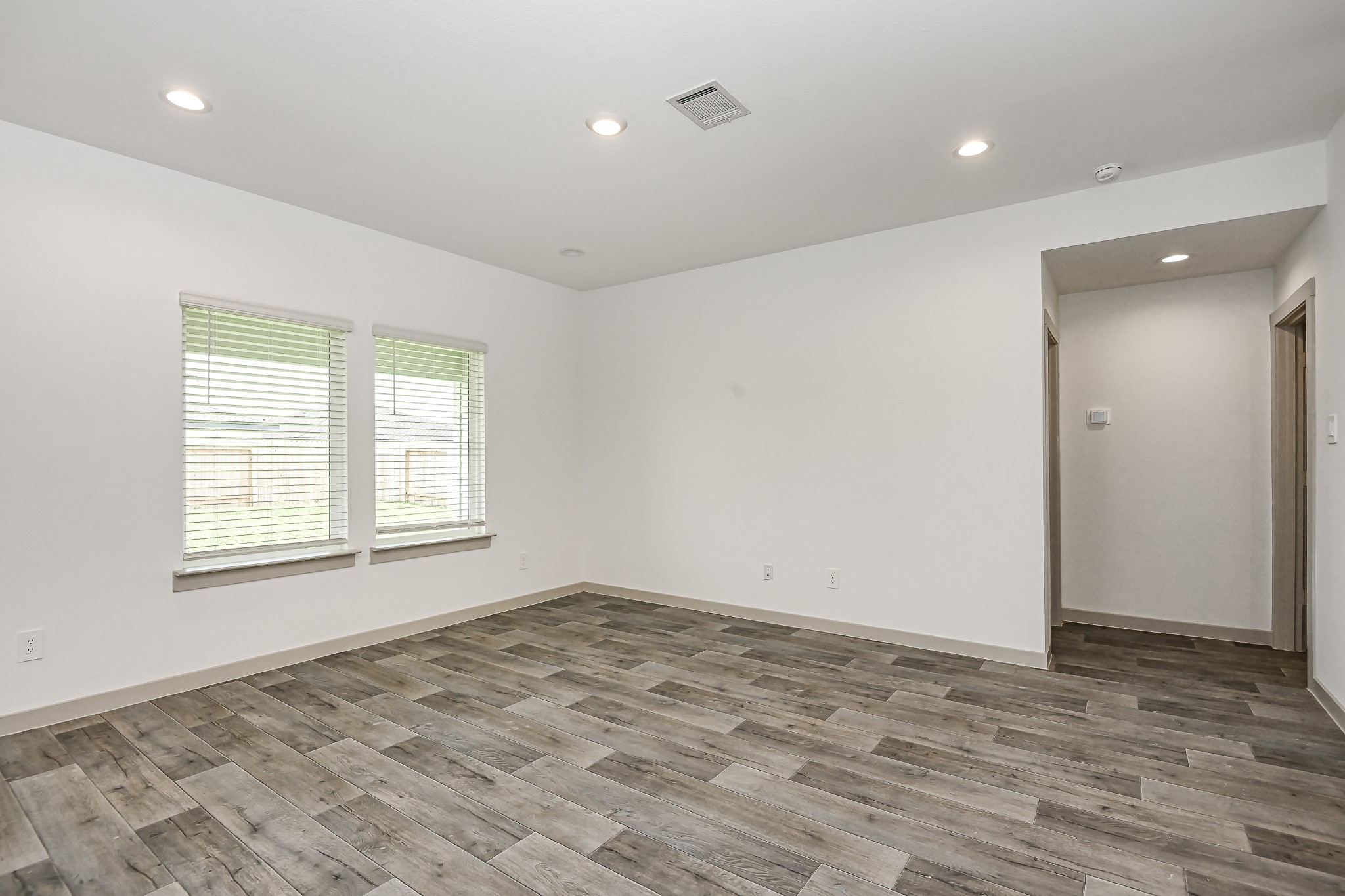 525 Hunter Grove Lane China, TX 77613 - Photo 11 of 27 a view of empty room with wooden floor and fan