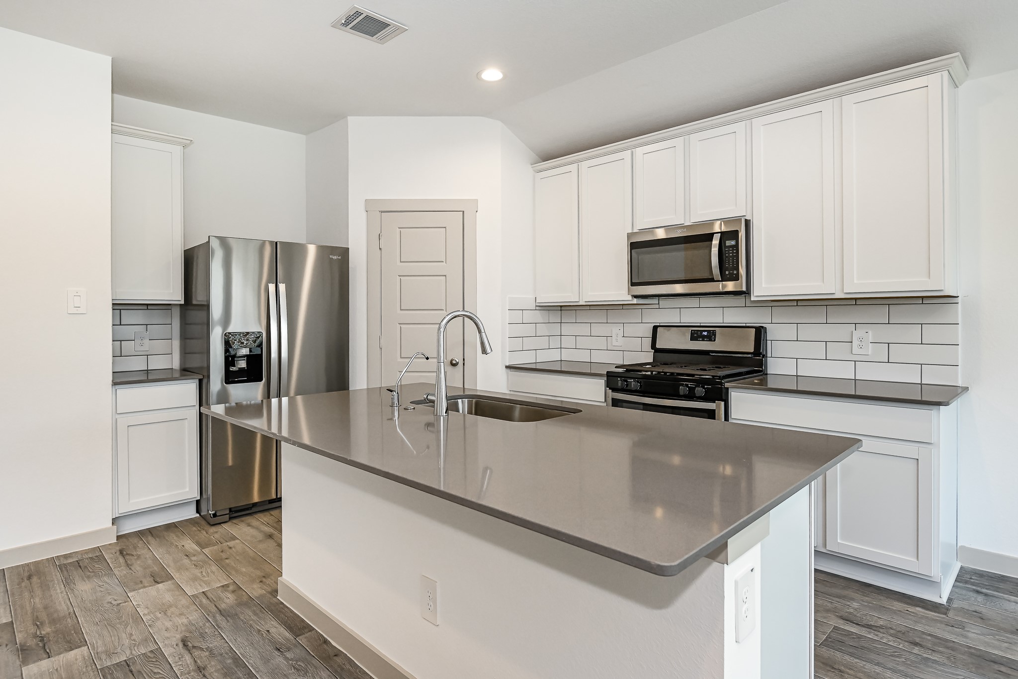 525 Hunter Grove Lane China, TX 77613 - Photo 4 of 27 a kitchen with stainless steel appliances a refrigerator stove microwave and sink