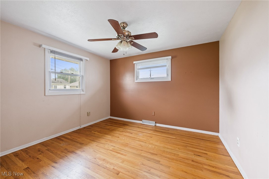 30844 Harrison Road Wickliffe, OH 44092 - Photo 11 of 30 Bedroom with light wood-type flooring and a ceiling fan