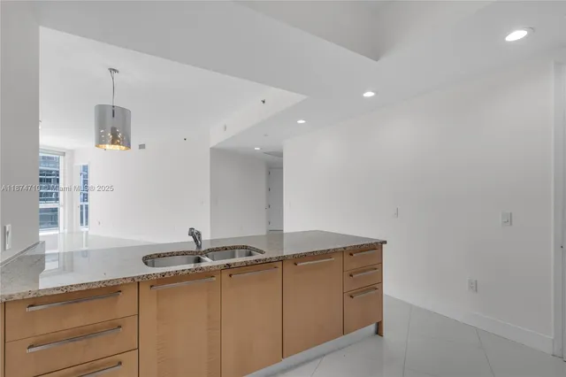 a bedroom with a bed and a wall painting