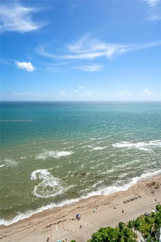 a view of swimming pool with outdoor seating