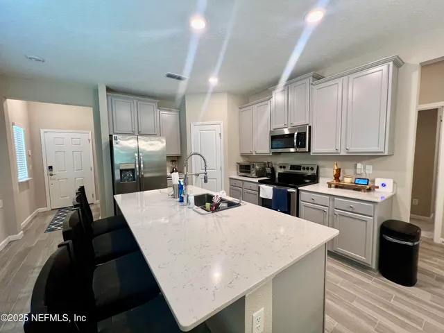 a bathroom with a tub and shower