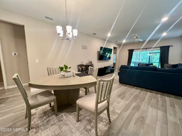 a bathroom with a double vanity sink toilet and a mirror