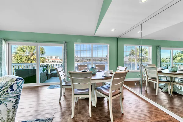 a view of a dining room with furniture window and wooden floor