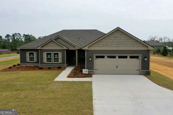 a front view of a house with swimming pool