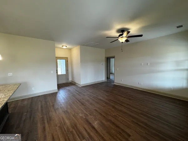 a view of empty room with windows