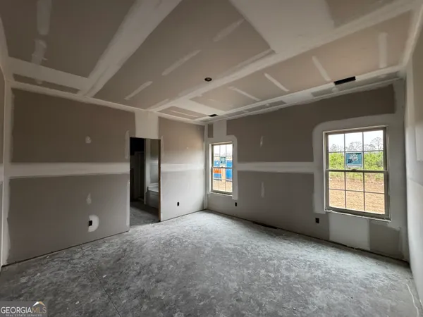 a kitchen with wooden cabinets and a wooden floor
