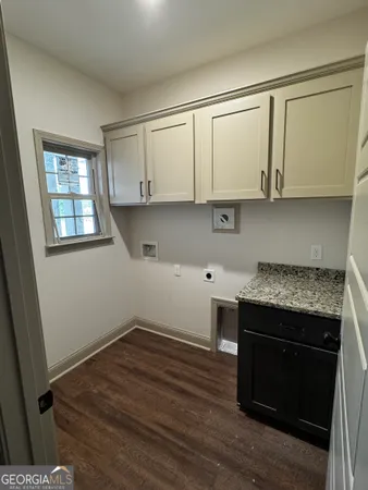 a bathroom with a bathtub and a window