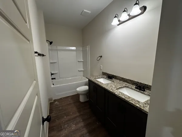 a view of a porch with furniture and a yard