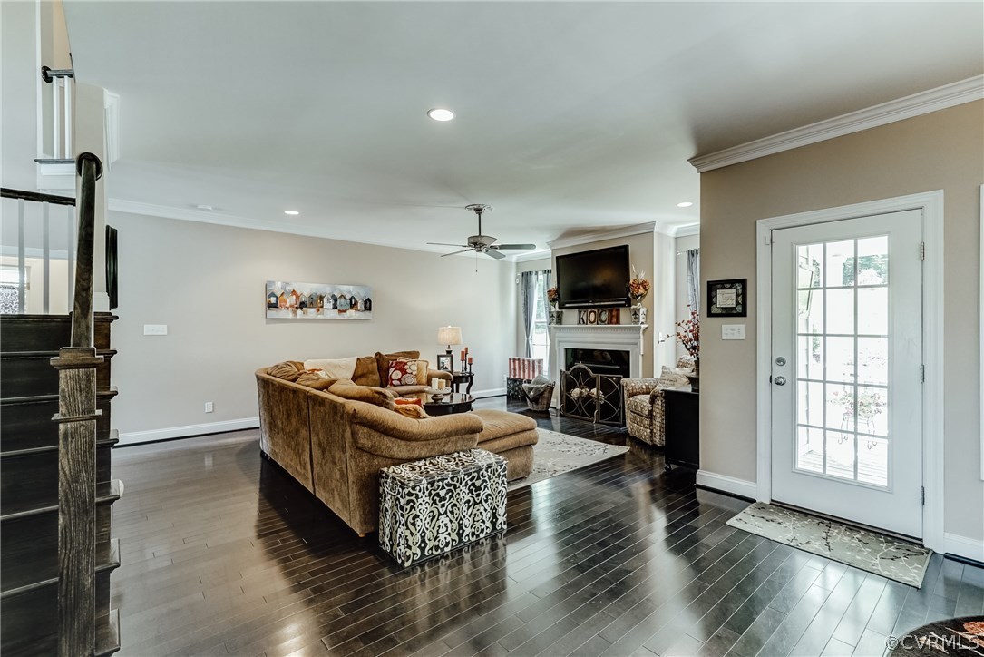 3119 Handley Road Midlothian, VA 23113 - Photo 15 of 41 a living room with furniture windows and a fireplace