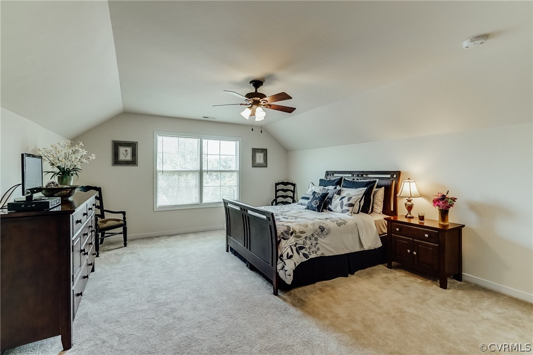 3119 Handley Road Midlothian, VA 23113 - Photo 33 of 41 a spacious bedroom with a bed and a chandelier