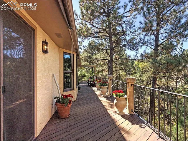 a view of a deck with wooden floor and seating space