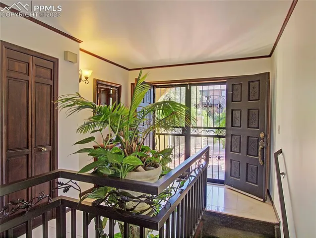 a view of a entryway door and wooden floor