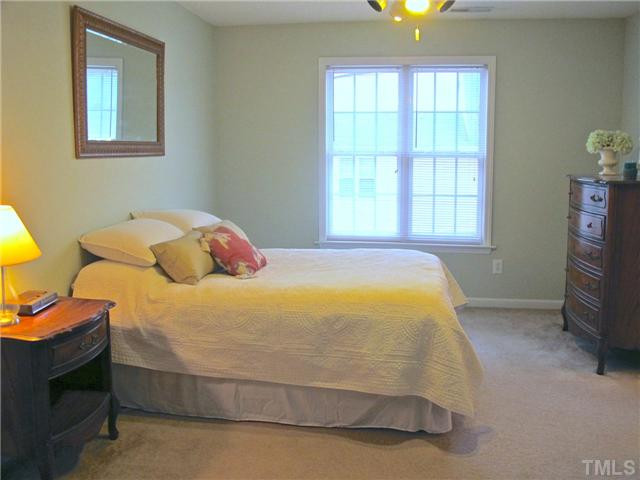 A huge master suite is again a perfect blend of neutrals with plenty of space for up to a king-size bed, additional dressers, and even a comfy chair tucked into one of the great corner spaces on either side of the door (out of view). Master Suite