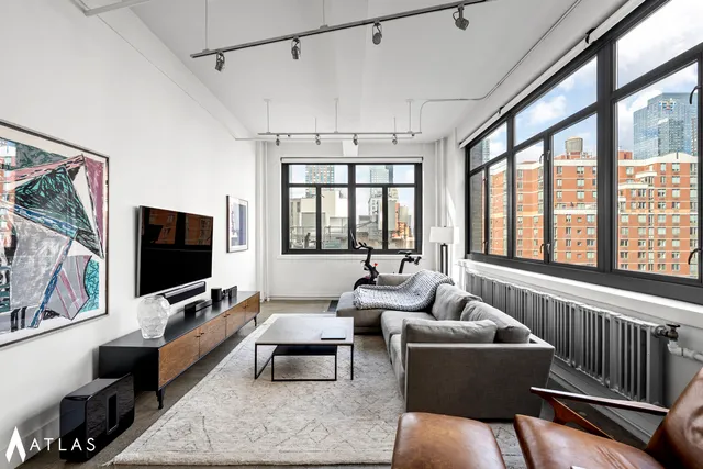 a bedroom with a bed and a table