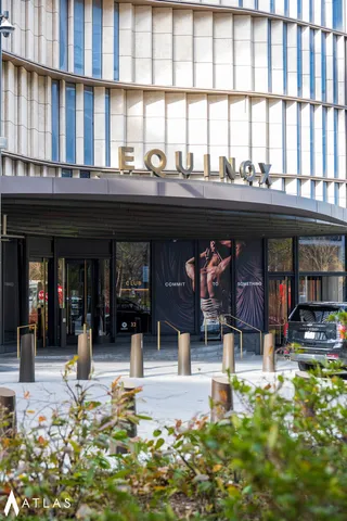 a stone house with a clock on the side of it