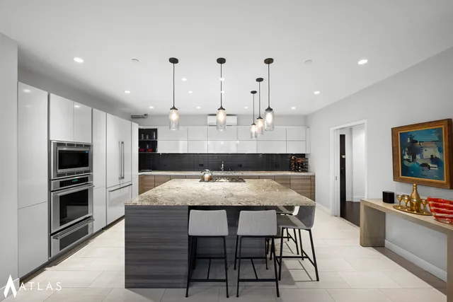 a living room with lots of furniture and white walls