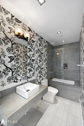 a large kitchen with a table and chairs