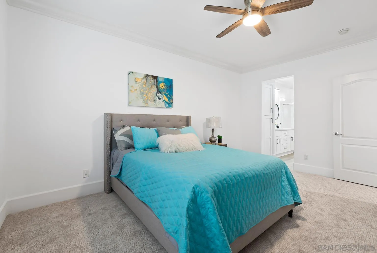 13002 Requlo Place San Diego, CA 92130 - Photo 11 of 17 a bedroom with a bed and a chandelier