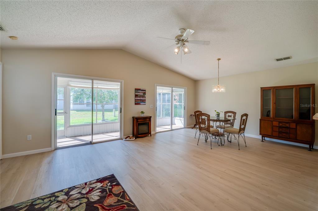 128 Crooked Pine Road Port Orange, FL 32128 - Photo 14 of 46 a view of a livingroom with furniture and a kitchen