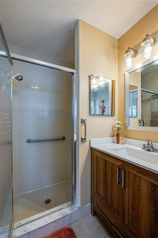 128 Crooked Pine Road Port Orange, FL 32128 - Photo 20 of 46 a bathroom with a sink and a mirror